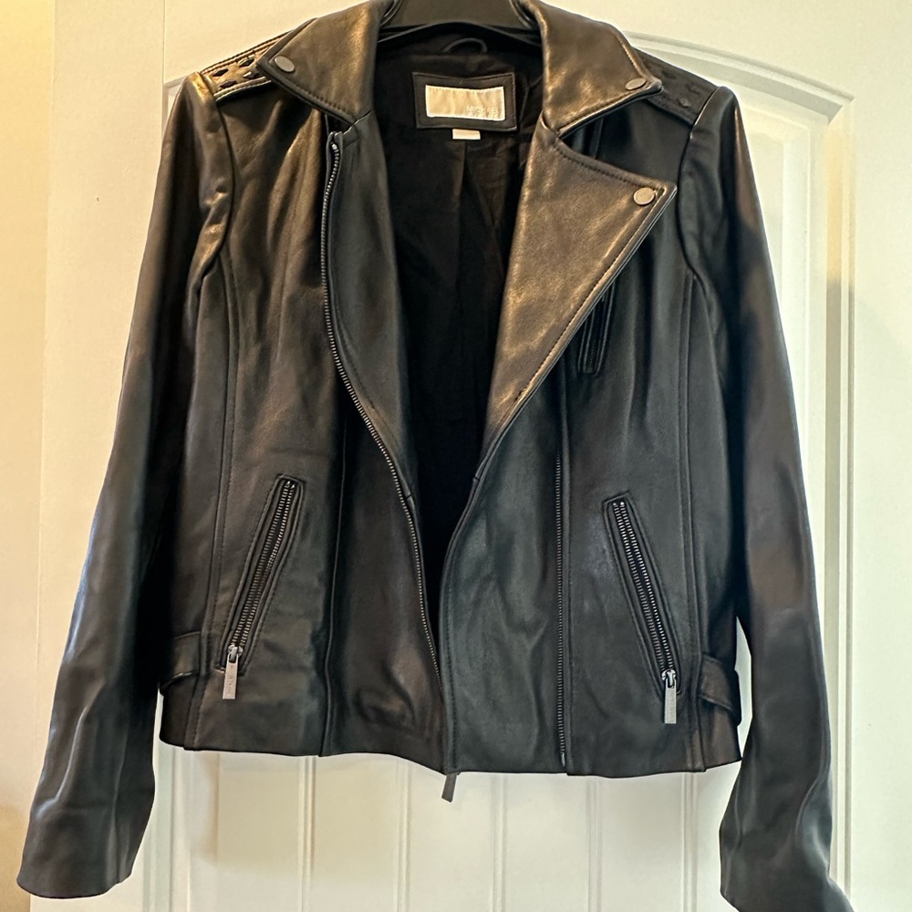 Micheal Kors 100% leather jacket. Worn a handful of times like new condition.